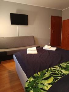 Postel nebo postele na pokoji v ubytování Bursztynowa 2