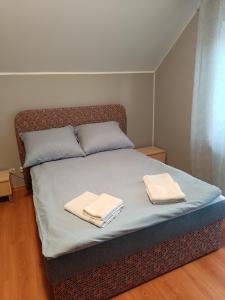 Postel nebo postele na pokoji v ubytování Bursztynowa 2
