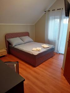 Postel nebo postele na pokoji v ubytování Bursztynowa 2