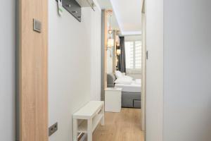 Postel nebo postele na pokoji v ubytování Palais Pálffy Apartments Vienna