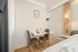 Postel nebo postele na pokoji v ubytování Palais Pálffy Apartments Vienna