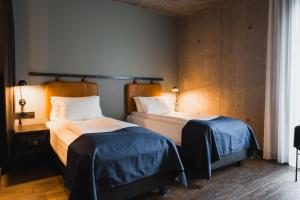 Postel nebo postele na pokoji v ubytování Exeter Hotel