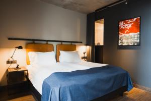 Postel nebo postele na pokoji v ubytování Exeter Hotel