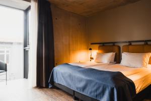 Postel nebo postele na pokoji v ubytování Exeter Hotel