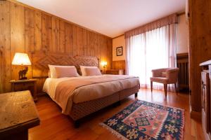 Postel nebo postele na pokoji v ubytování Hotel Bouton d'Or - Courmayeur