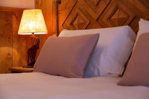 Postel nebo postele na pokoji v ubytování Hotel Bouton d'Or - Courmayeur