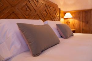 Postel nebo postele na pokoji v ubytování Hotel Bouton d'Or - Courmayeur