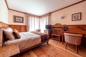 Postel nebo postele na pokoji v ubytování Hotel Bouton d'Or - Courmayeur