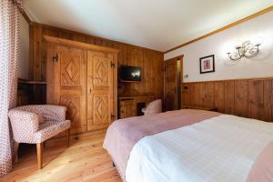 Postel nebo postele na pokoji v ubytování Hotel Bouton d'Or - Courmayeur