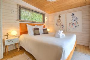 Ένα ή περισσότερα κρεβάτια σε δωμάτιο στο Lodge Secret avec Jacuzzi +20 φωτογραφίες