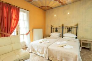 A bed or beds in a room at Dimatis