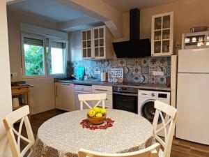 a kitchen with a table with a bowl of fruit on it at Bellavista in Santander