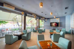 a restaurant with blue chairs and tables and a cafeteria at Asteria Family Sunny Beach - Ultra All Inclusive in Sunny Beach