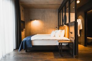 Postel nebo postele na pokoji v ubytování Exeter Hotel
