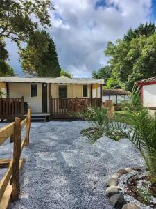 a house with a fence in front of it at camping soleiluna in Herm
