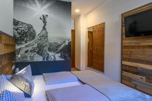 Postel nebo postele na pokoji v ubytování Hotel Alpensonne