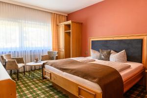 Postel nebo postele na pokoji v ubytování Hotel Alpensonne