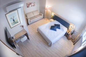 Кровать или кровати в номере Hotel Le Golfe
