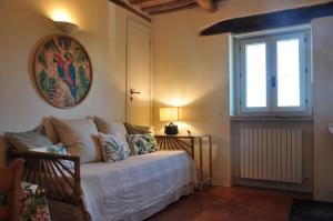 Postel nebo postele na pokoji v ubytování Agriturismo SPA Serpanera