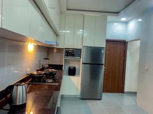 Kuchyňa alebo kuchynka v ubytovaní Sha'an Residence