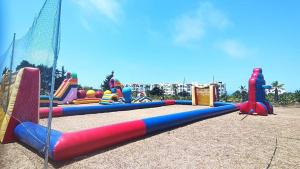 a playground with a bunch of play equipment at Marina Golf Asilah vue mer in Asilah