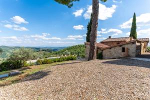 an exterior view of a house with a tree at Bellaria Apartments - Chianti View, Swimming Pool, Nature in San Sano