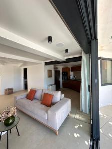 a living room with a couch and a table at Maï Homes - La Villa Bompard in Marseille
