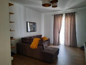 a living room with a couch and a chair and a window at Il filo di Arianna in Putignano