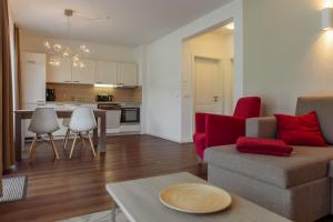 a living room with a couch and a table at Elbresort Kurort Rathen in Rathen