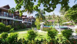 a view of the resort from the garden at Maehaad Bay Resort - SHA Plus in Mae Haad