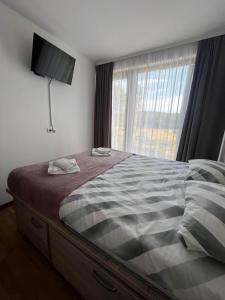 Postel nebo postele na pokoji v ubytování Apartman Borovi 14