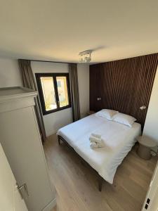 a bedroom with a large white bed and a window at VillaGassin 380 Luxury Villa with Private Pool near Saint-Tropez - Airco-Parking in Saint-Tropez +11 photos