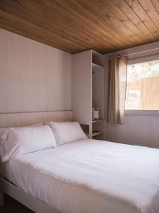 Posteľ alebo postele v izbe v ubytovaní wecamp Cala Montgó
