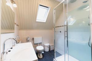 a bathroom with a shower and a toilet at 't Eekhoornnest in Soest +193 photos