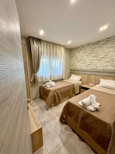 Postel nebo postele na pokoji v ubytování Villa Harmony + 28 fotografií