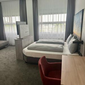 Postel nebo postele na pokoji v ubytování Rimedya Hotel - an der Messe München