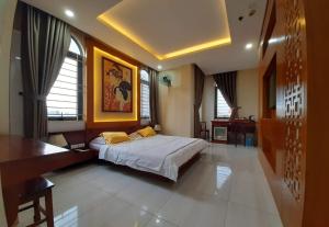 Ένα ή περισσότερα κρεβάτια σε δωμάτιο στο Hotel Phú Sĩ
