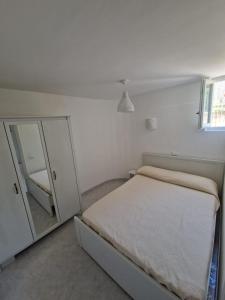 Postel nebo postele na pokoji v ubytování Dory's Dream - CASA VACANZE NUMANA