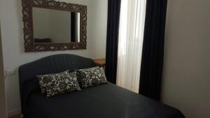 Ένα ή περισσότερα κρεβάτια σε δωμάτιο στο Appartamento Luxury - Mare