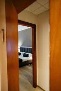 Postel nebo postele na pokoji v ubytování Grand Hotel la Chiusa di Chietri