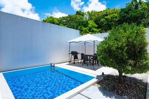 Bazén v ubytování Secret Villas by Relapool nebo v jeho okolí
