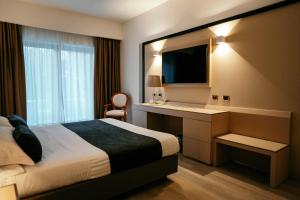 Postel nebo postele na pokoji v ubytování Grand Hotel la Chiusa di Chietri