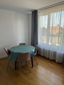 a table and chairs in a room with a window at Casa Conti in Sibiu +39 photos