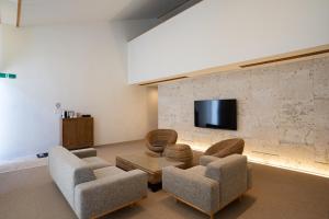 TV a/nebo společenská místnost v ubytování Secret Villas by Relapool
