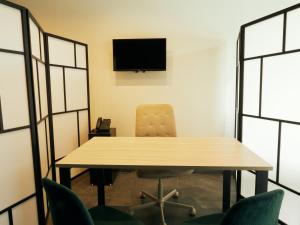 TV a/nebo společenská místnost v ubytování HUB Rooms