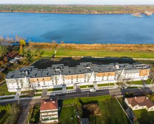 an aerial view of a large building next to the water at MG52 Luksusowy apartament z widokiem na Zalew Zegrzyński in Zegrze Południowe