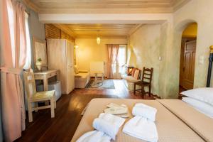 A bed or beds in a room at Dimatis