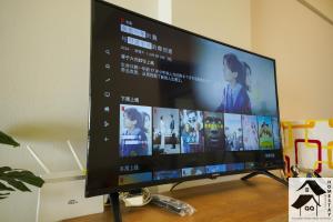 a flat screen tv sitting on top of a table at Nice Seaview Apartment with 2R1B in Port Dickson