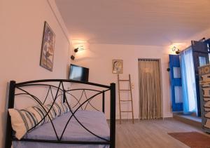 TV a/nebo společenská místnost v ubytování Stamatis Rooms