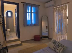 Postel nebo postele na pokoji v ubytování Stamatis Rooms